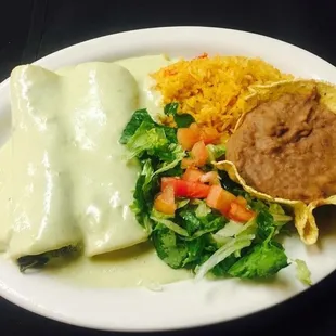 Delicious Spinach enchiladas with our cream sauce.