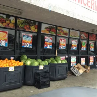 a storefront with fruit and veggies