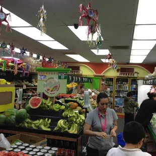 people shopping in a grocery store
