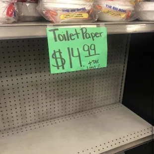 a toilet paper sign in a store