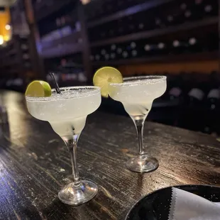 two margaritas on a bar