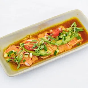 Happy Hour Seared Salmon Crudo with aji amarillo ponzu, red onion, cucumber, cilantro, &amp; avocado
