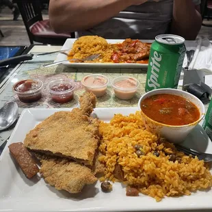 Breaded Steak with red salsa sauce &amp; arroz con gandules.