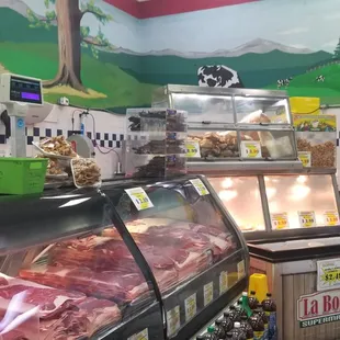 a display of meat in a deli