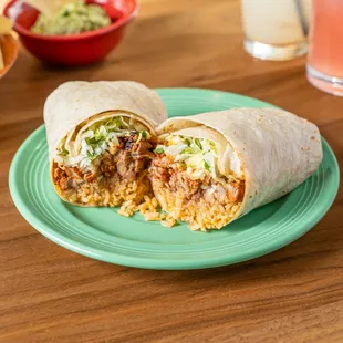 a burrito on a plate with chips