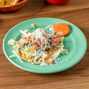a plate of mexican food on a table