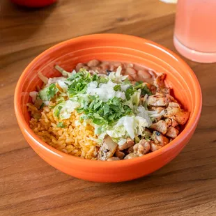 a bowl of mexican food on a table