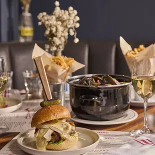 a plate of food and a glass of wine