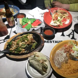 Chicken fajitas (center bottom), Fajita burrito (top right)