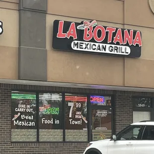 a car parked in front of the restaurant