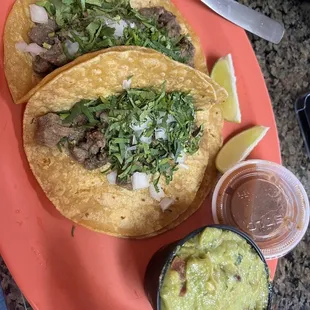 Two carne asasa tacos a la carte, & 4 oz guacamole