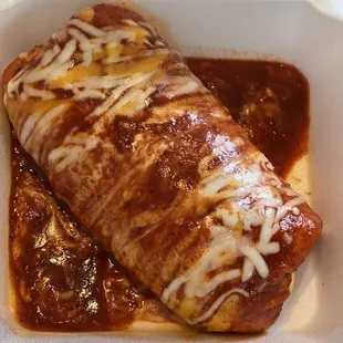 a burrito in a styrofoam container