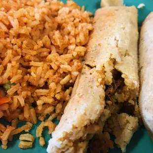 Tamales lunch special with pork filling and rice, no beans
