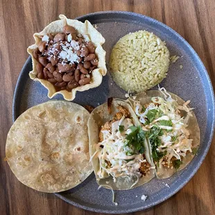 Chicken tacos, flour tortillas, lime rice, and beans