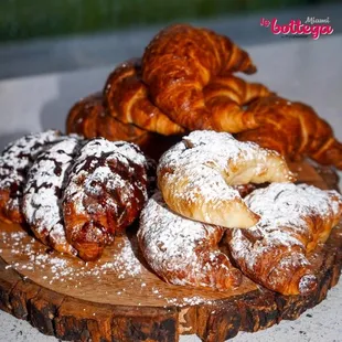 a variety of pastries on a wooden board