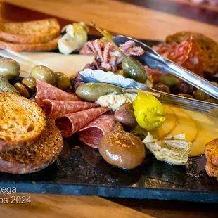 ANTIPASTO PLATTER Cured Meats, Cheeses, Marinated Vegetables, Olives, Baby Octopus, Crostini