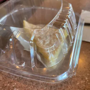 a banana in a plastic container