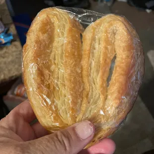 Pretzel-like, hard as a rock bakery item that is NOT a cinnamon roll with nuts.