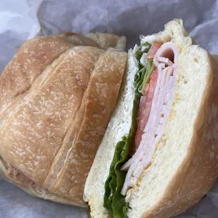 Smoked turkey on croissant.