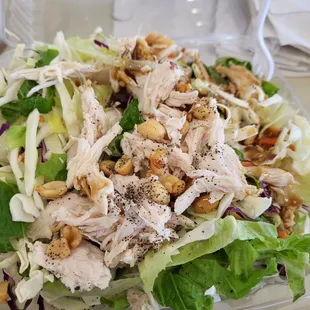a salad with chicken and lettuce
