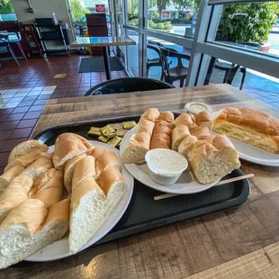 While sliced Baguette , Baked Ham cheese croissant