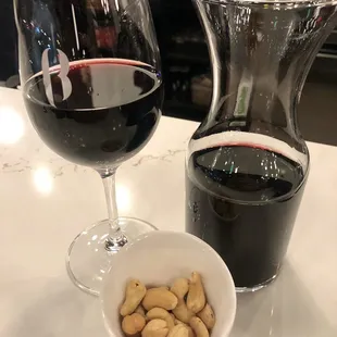 Happy Hour = 25% off all tap wines (glass or carafe). They gave me some cashews, too!