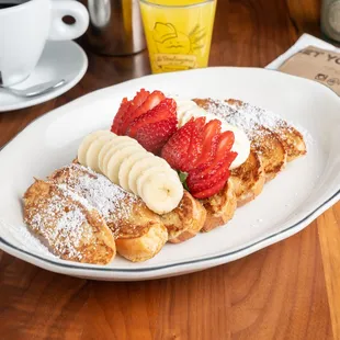 Pain Perdu, homemade French toast with fresh bananas and strawberries.