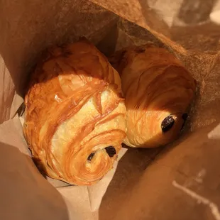 Deux (two) chocolate croissants basking in the sun