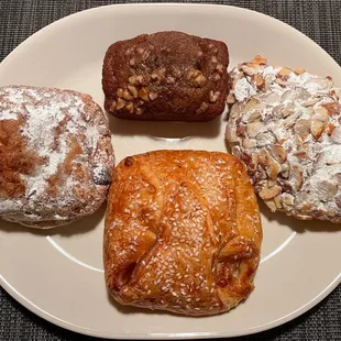 Chocolate hazelnut croissant, banana poundcake, almond croissant, and ham and Brie croissant