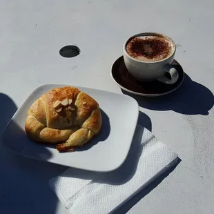 Almond croissant and cappuccino