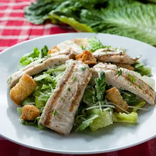 a plate of chicken and lettuce salad