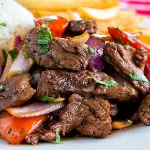 a plate of beef and vegetables