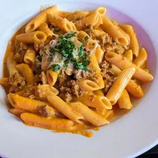 Pasta Abituale with tomato cream sauce and sausage.