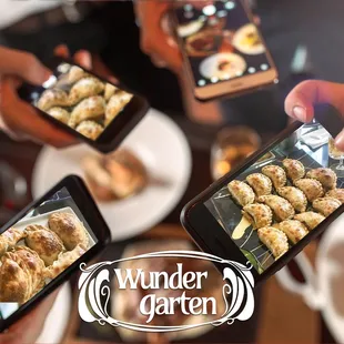 a group of people taking pictures of food