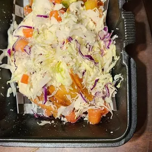 a salad in a plastic container