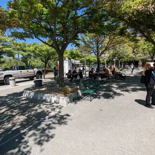 a crowd of people standing and sitting