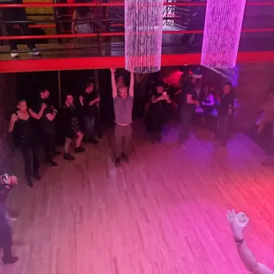 a group of people dancing in a room