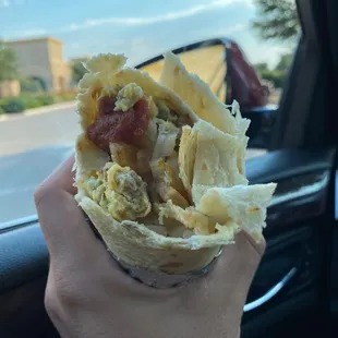 Sausage and egg burrito w/ plain potatoes, onions, and mild salsa.