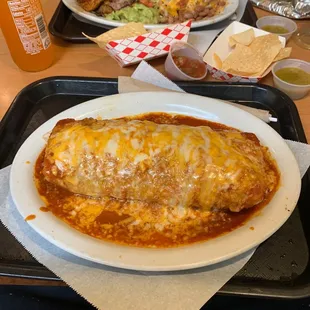 Burrito mojado and fajitas plate on the other side