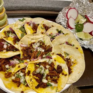 Al Pastor tacos. Their green and orange salsa are a must!!