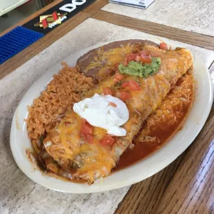 a plate of enchiladas and rice