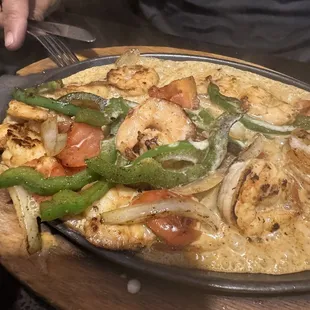 This plate came to my husband sizzling tasty hot!