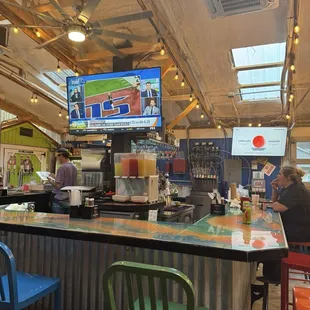 The bar in the patio. Lots of TVs.