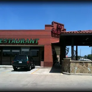 a car parked in front of the restaurant