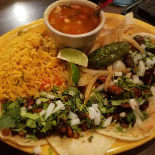 El pastor taco plate with charro beans and Mexican rice ! Delish!!