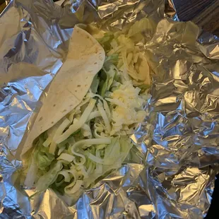 a tortilla wrapped in aluminum foil