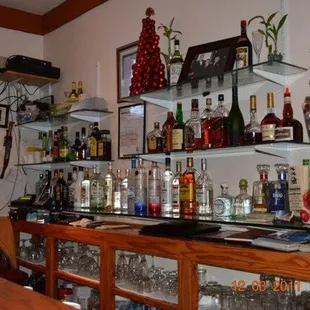 a bar with liquor bottles on the shelves