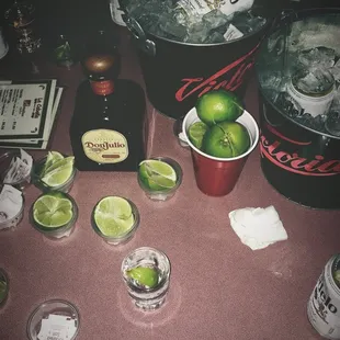 limes, limes, and ice on a table