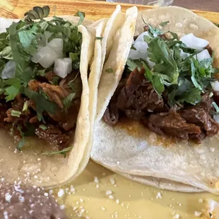 two tacos on a yellow plate