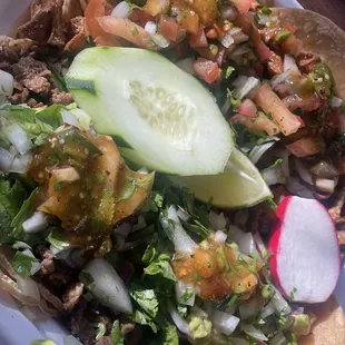 2 carne asada tacos and 2 tripa tacos